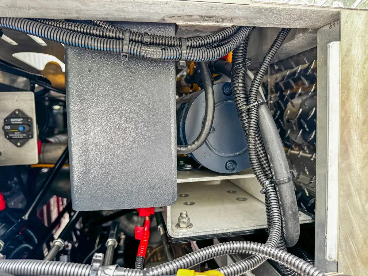 Open side compartment view with shelf and red compartment door.